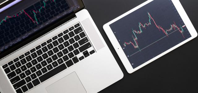 Investment business technology app on digital screen