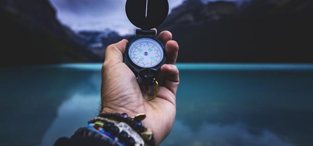 Man holding a compass